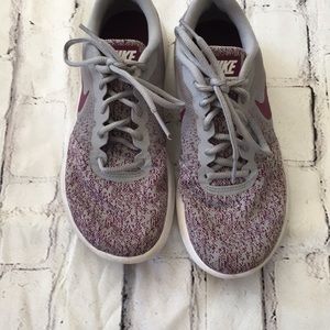 Grey and burgundy size 7 Nike shoes.